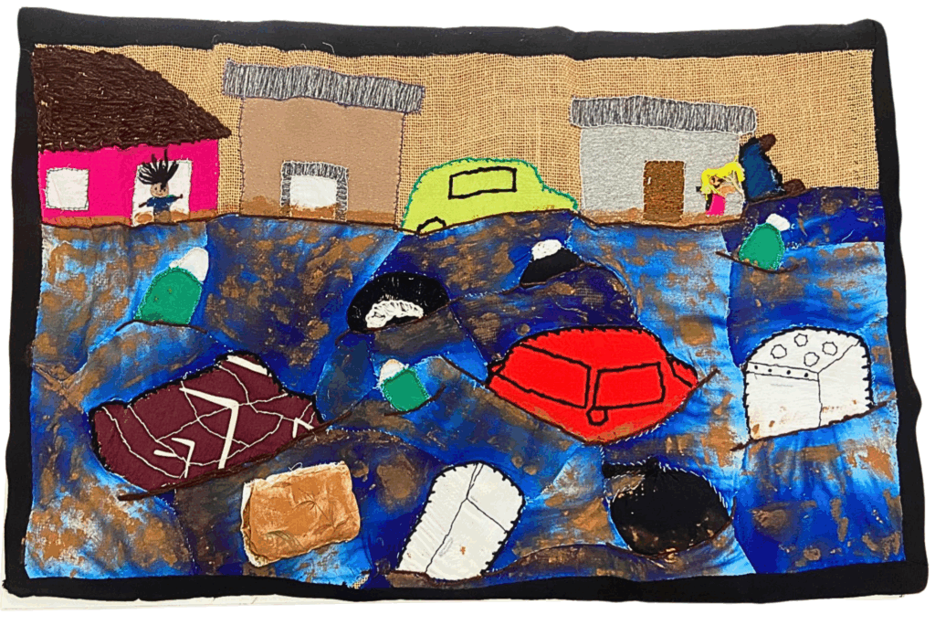 A arpillera expressa a realidade das famílias do Jardim Pantanal, na Zona Leste de São Paulo, com as enchentes decorrentes da Barragem da Penha. Foto: Comunicação MAB